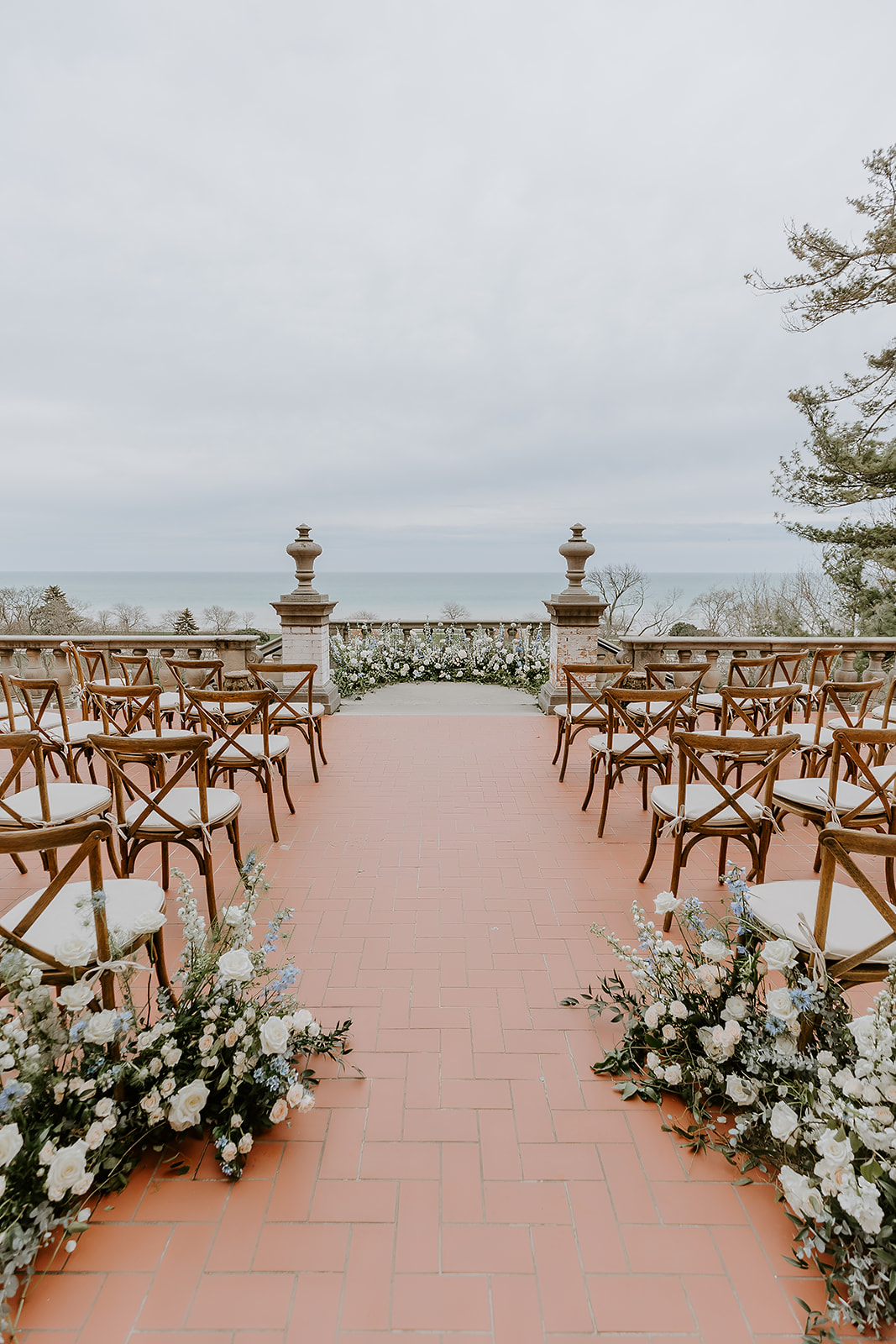 Ceremony setup at The Villa Terrace in Downtown Milwaukee on the back terrace overlooking Lake Michigan. 
