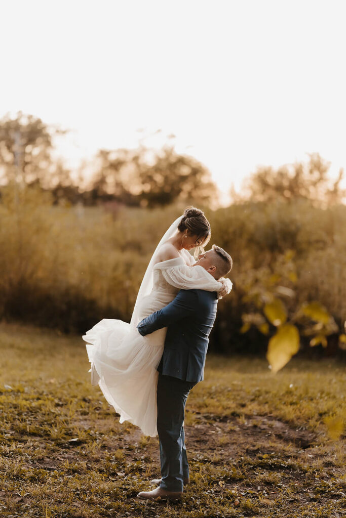 bride and groom embracing by wedding coordinator madison wi