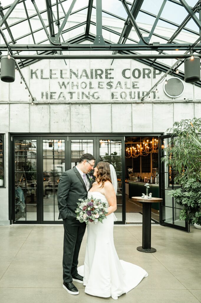 bride and groom in front of wedding venue by event coordinator madison wi