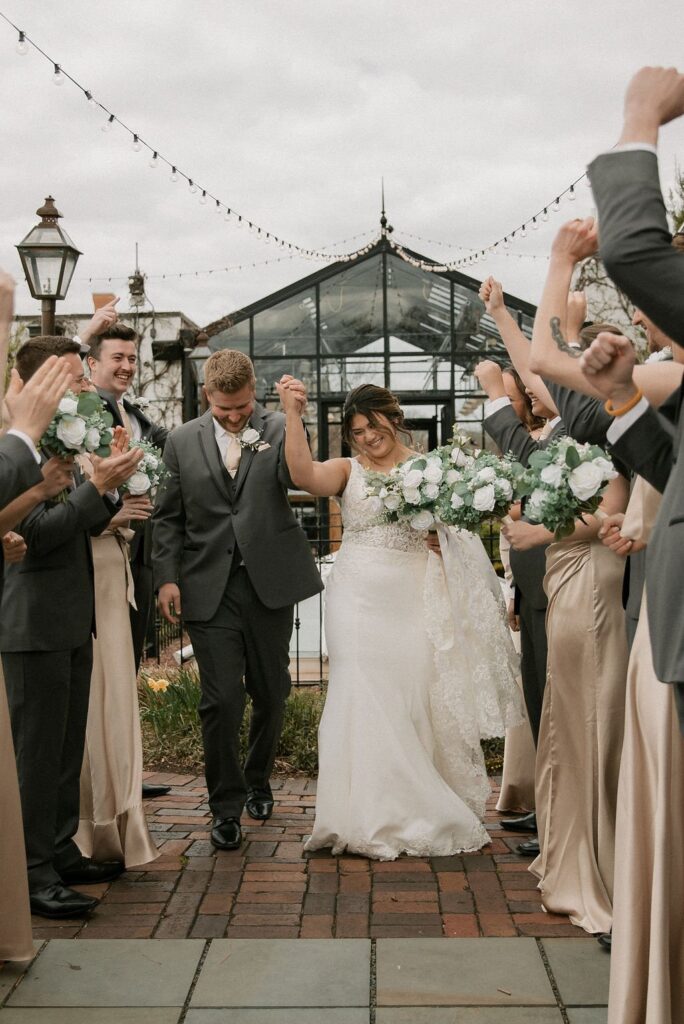 bride and groom walking at small wedding venues milwaukee