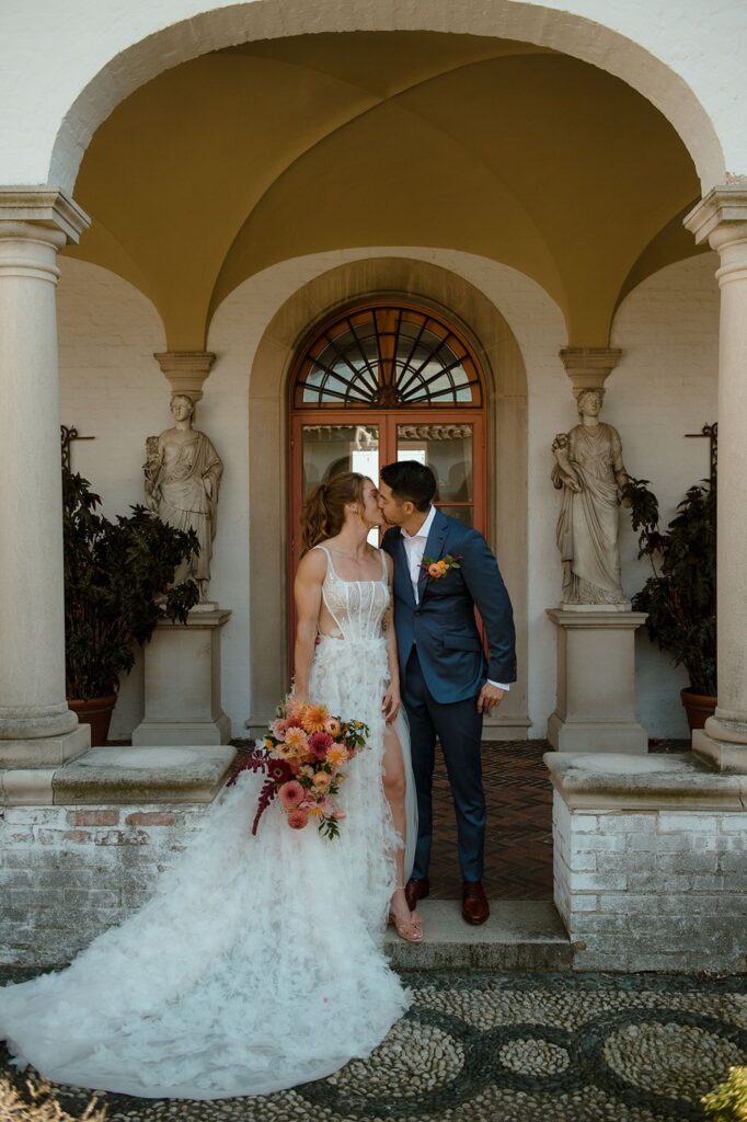 couple kissing at one of the best wedding venues in milwaukee