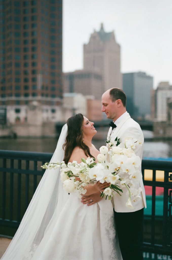 bride and groom on balcony at best wedding venues in milwaukee