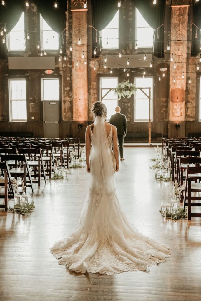 couple at one of the best milwaukee wedding venues turner hall ballroom with bride posing