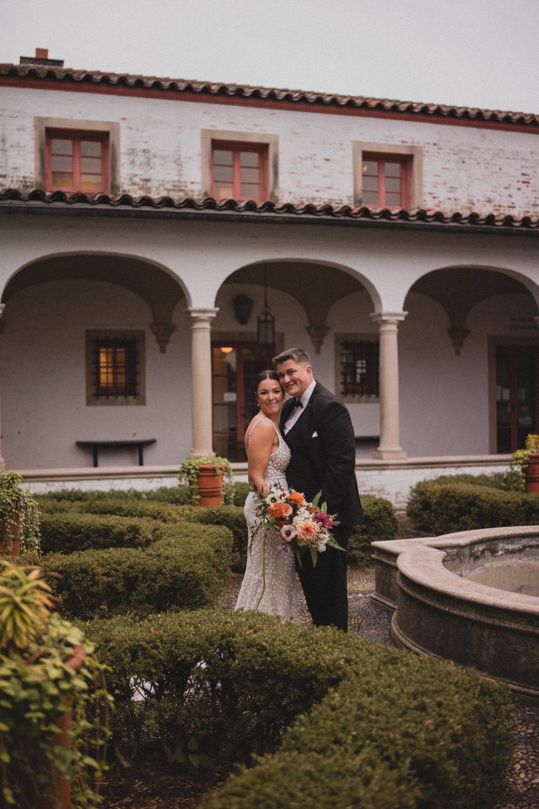 couple posing at their outdoor wedding venue planned by their local milwaukee wedding and even planners