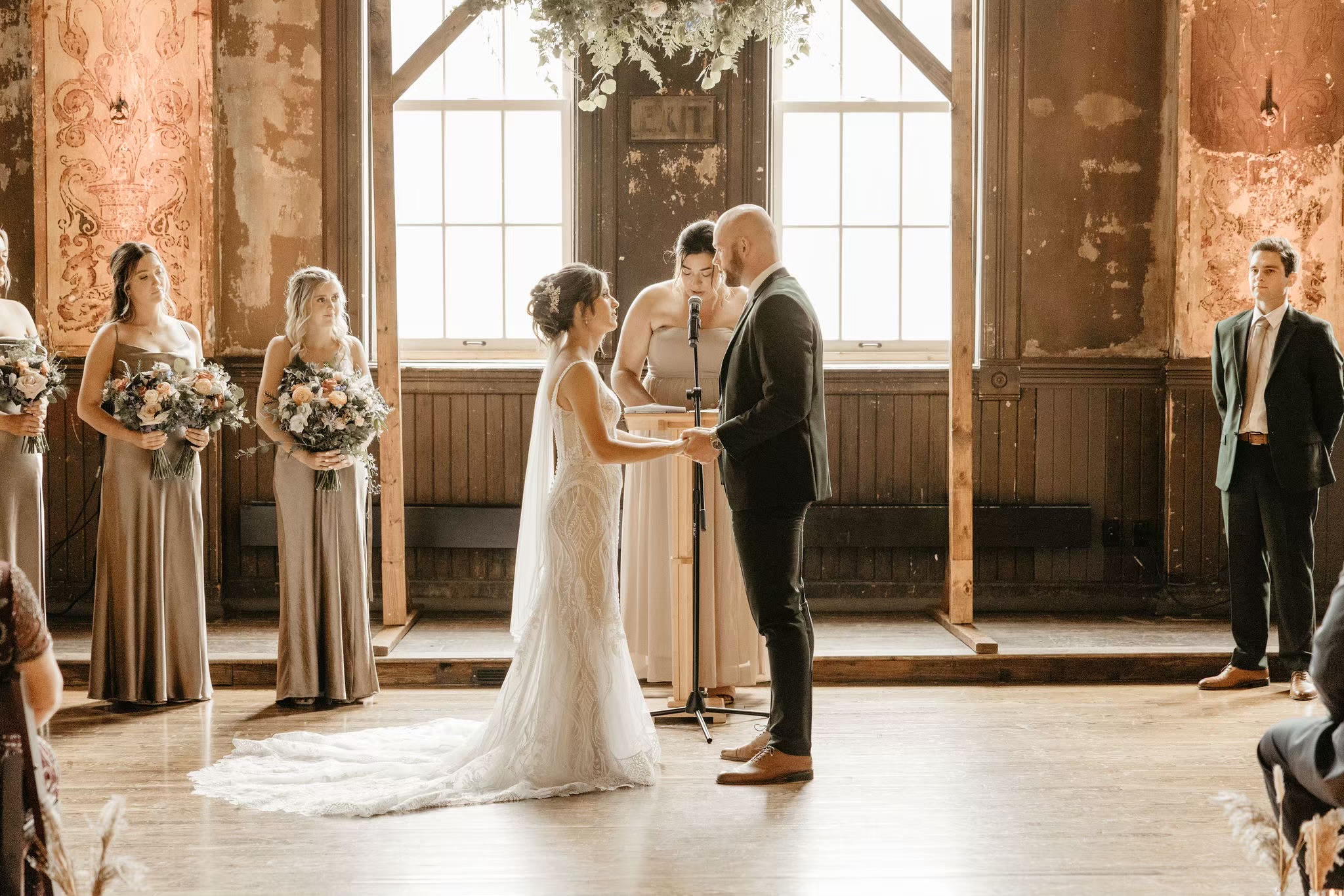Bride and groom at alter at indoor wedding ceremony