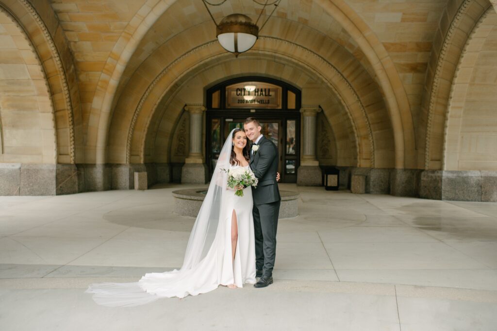 couple smiling at a wedding venue in Milwaukee, WI