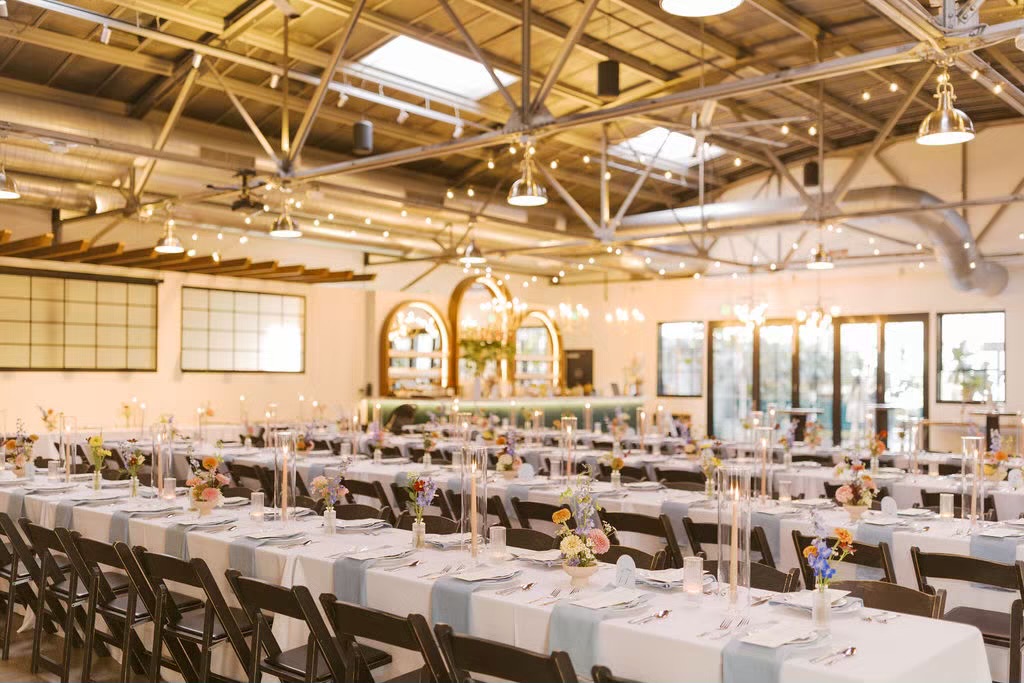 Indoor wedding venue at reception with empty chairs