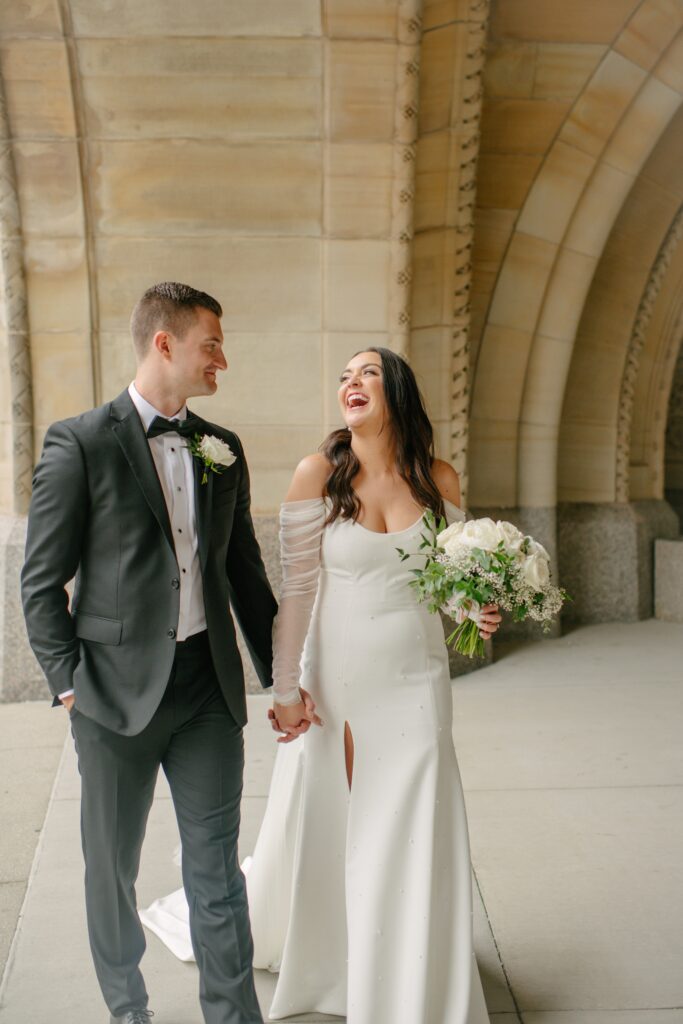 close-up portrait of bride and groom walking and laughing during their photoshoot at their lake geneva wedding