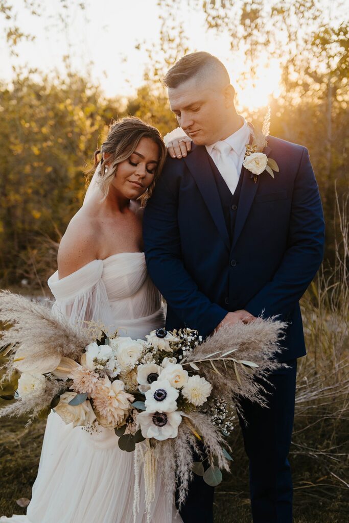 Bride and groom sharing a quiet moment during golden hour at an outdoor Wisconsin wedding