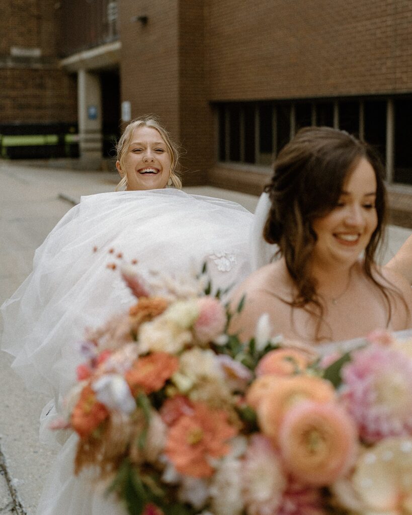 Madison wedding planner assisting a bride before the ceremony at an industrial Wisconsin wedding venue